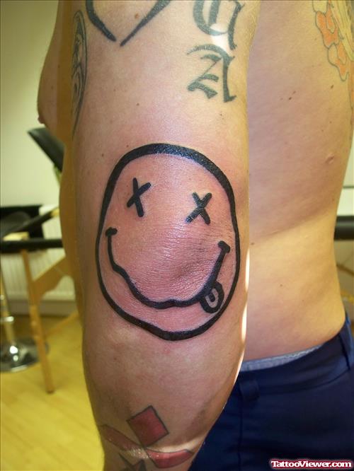 Smiley Tattoo On Elbow
