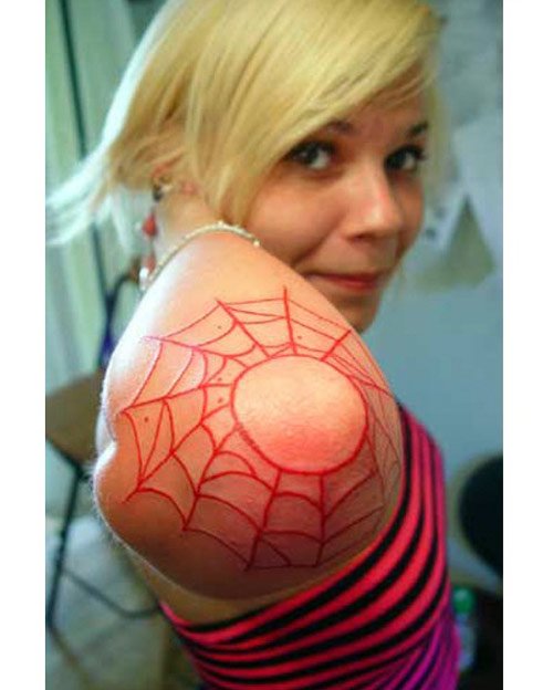 Red Ink Spider Web Elbow Tattoo