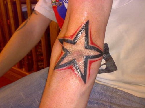 Black And Red Star Elbow Tattoo