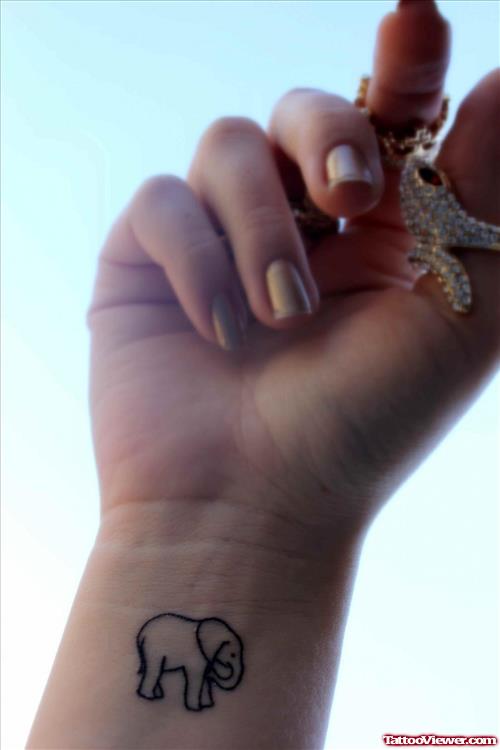 Small Elephant Tattoo On Girl Wrist
