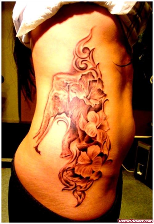 Grey Flowers And Elephant Tattoo On Side Rib