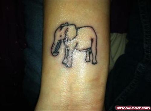 Tiny Elephant Tattoo On Arm