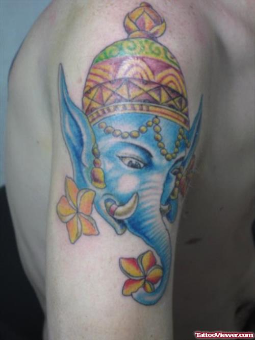 Blue Ink Elephant Head Tattoo With Crow And Flowers