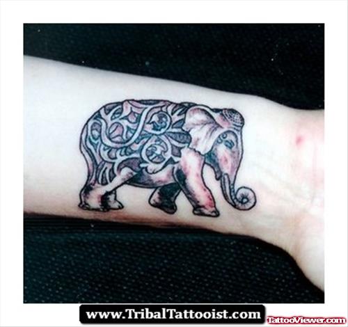 Awesome Grey Ink Tribal Elephant Tattoo On Forearm