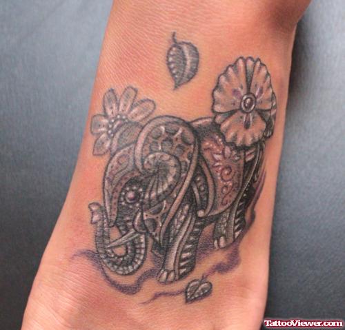 Grey Ink Elephant And Flower Tattoo On Left Foot