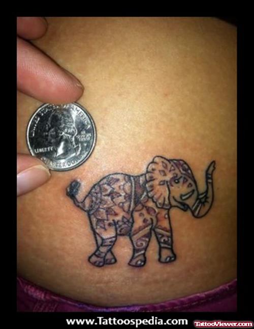 A Coin And Elephant Tattoo