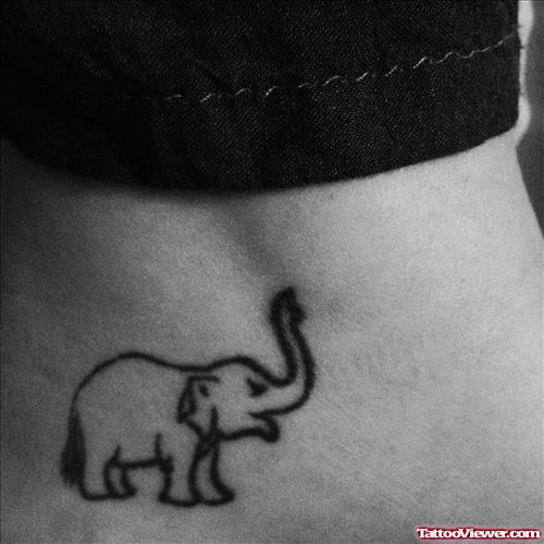 Small Outline Elephant Tattoo On Girl Lowerback