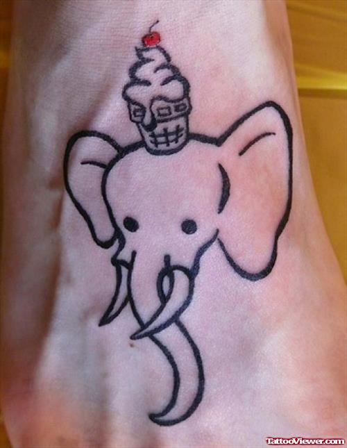 Outline Elephant Head Tattoo With Cupcake