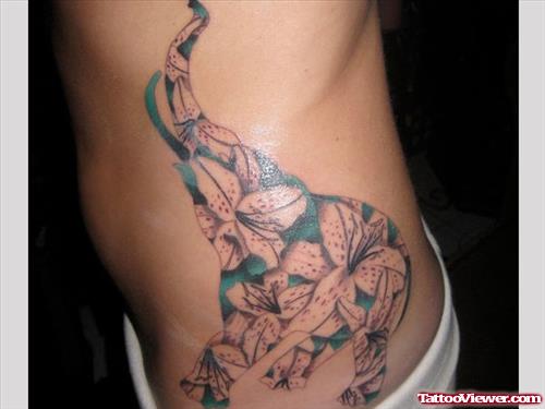 Flowers Elephant Tattoo On Left Rib