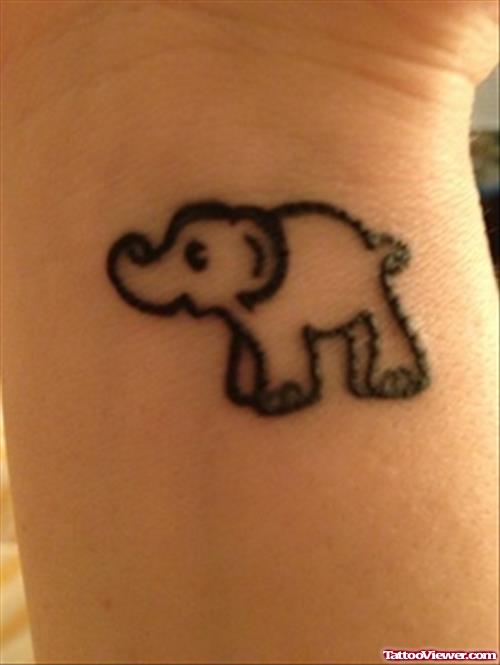 A Tiny Elephant Tattoo On Wrist