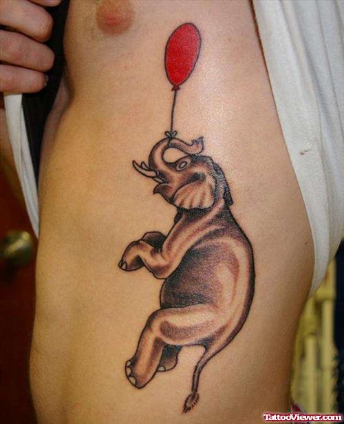 Red Ballon And Elephant Tattoo On Rib Side