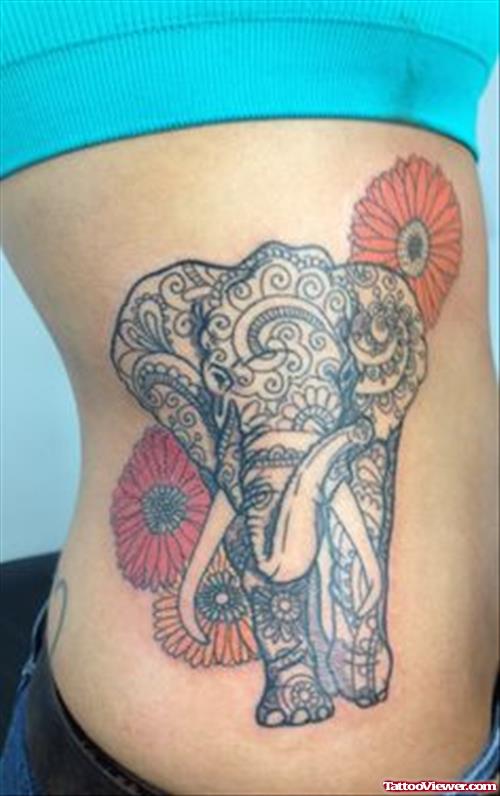 Colored Flowers And Indian Elephant Tattoo On Side Rib