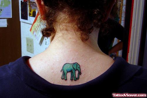 Green Elephant Tattoo On Upperback