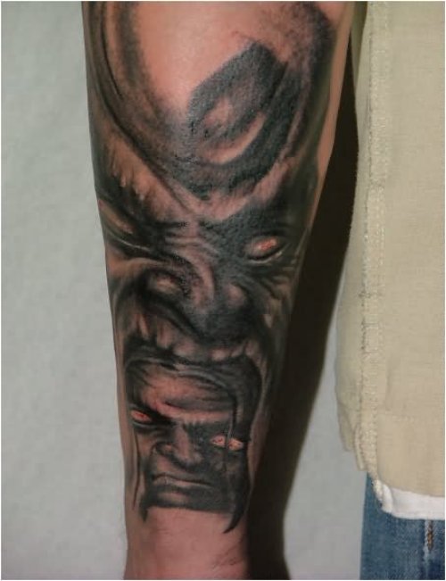 Scary Evil Tattoo On Sleeve