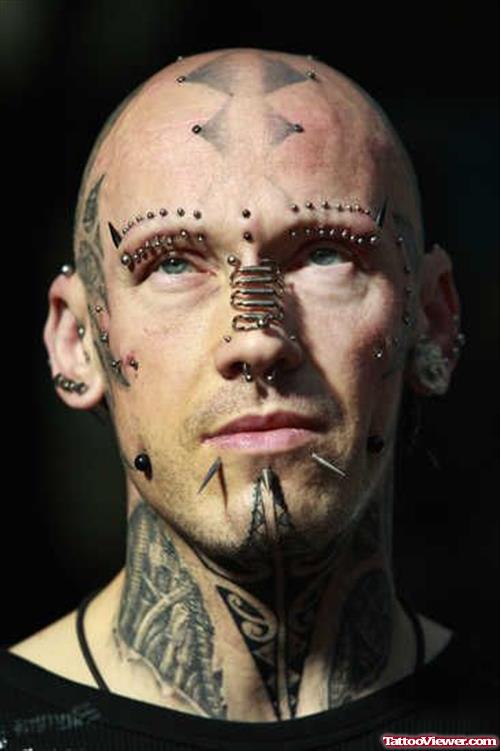 Guy With Extreme Tattoo On Face and Neck