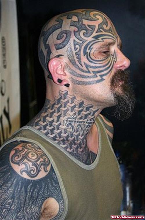 Man With Tribal And Geometric Dotwork Extreme Tattoo On Face