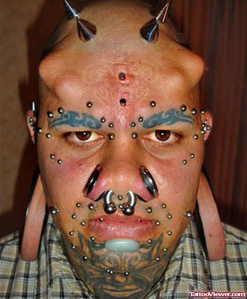 Extreme Tattoo and Piercing On Face
