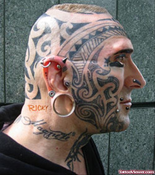 Piercings And Extreme Tattoo On Face And Head