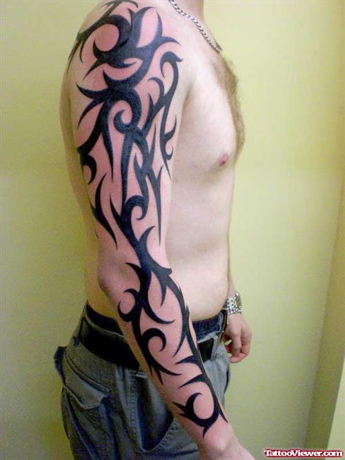 Extreme Black Tribal Tattoo On Man Right Sleeve