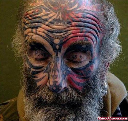 Extreme Tribal Colored Old Man Face Tattoo