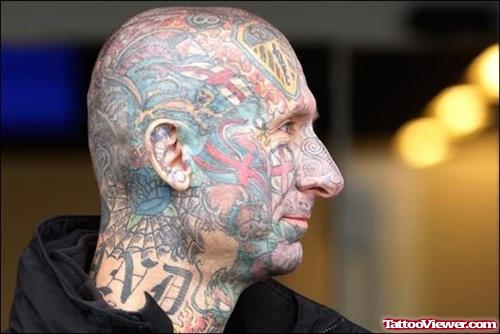 Colored Extreme Tattoo On Face And Head