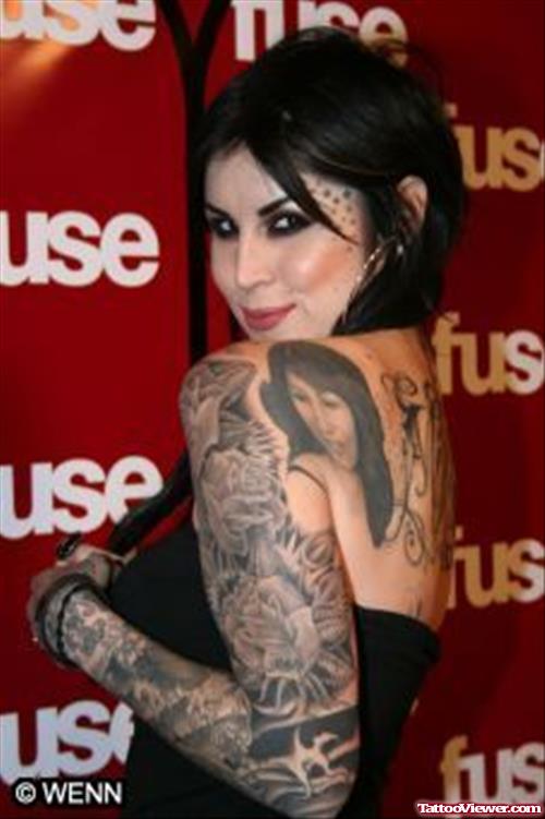 Grey Ink Tattoo On Girl Left Sleeve