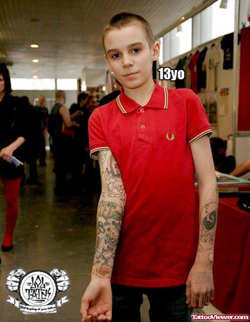 Child With Extreme Tattoo On Right Sleeve