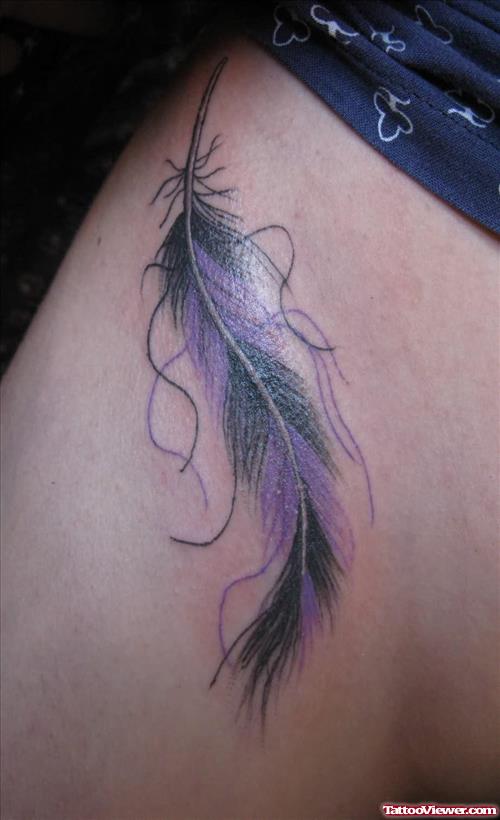 Black And Purple Ink Extreme Feather Tattoo On Side