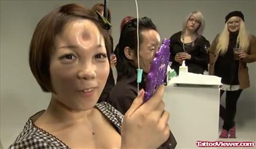 Extreme Tattoo On Girl Forehead