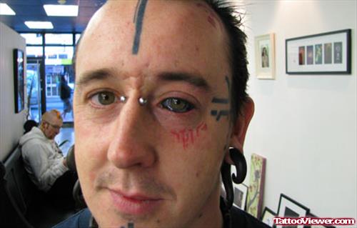 Extreme Eyeball And Face Tattoos
