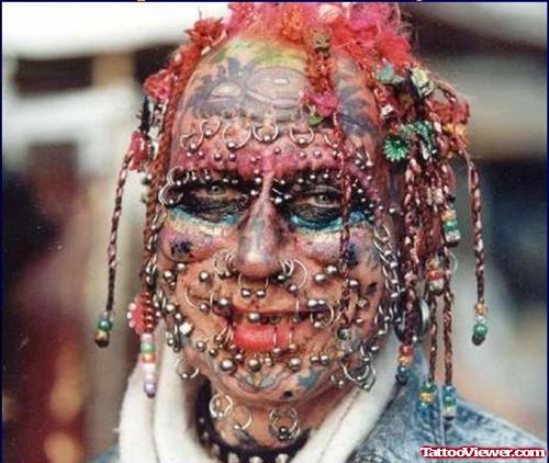 Colored Extreme Face Tattoo And Piercings