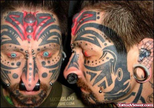 Extreme Black Tribal Face Tattoo