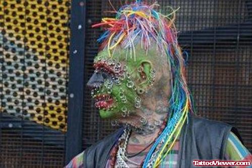 Awesome Colored Extreme Tattoo On Face