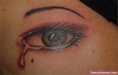 Grey Ink Crying Eye Tattoo