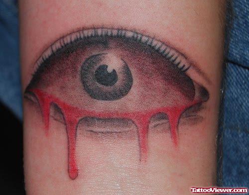 Attractive Bleeding Eye Tattoo On Bicep