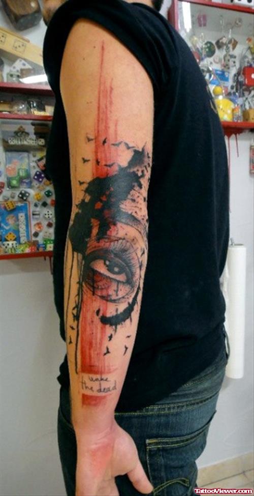 Abstract Colored Eye Tattoo On Man Left Sleeve