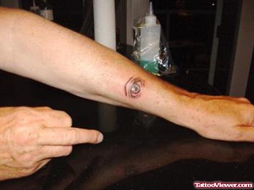 Small Eye Tattoo On Left Arm