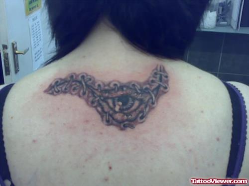 Grey Ink Eye Tattoo On Girl Upperback