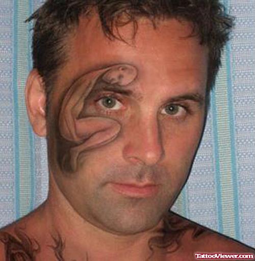 Grey Ink Tattoo Around Eye For Men