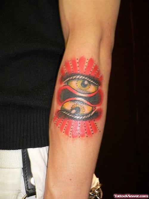 Eye Tattoos On Man Left Sleeve