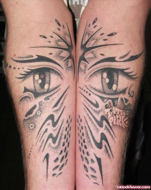 Black Tribal And Eye Tattoos On Both Forearm