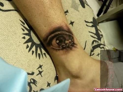 Brown Eye Tattoo On Ankle