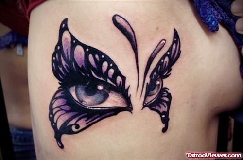 Butterfly And Eye Tattoo On Rib