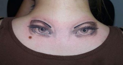 Grey Ink Eye Tattoos On Upperback