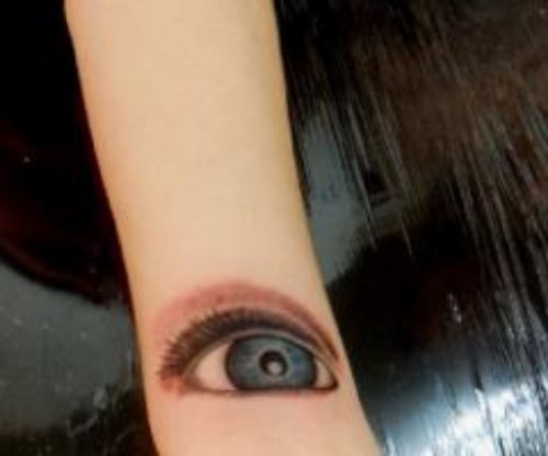 Colored Eye Tattoo On Sleeve