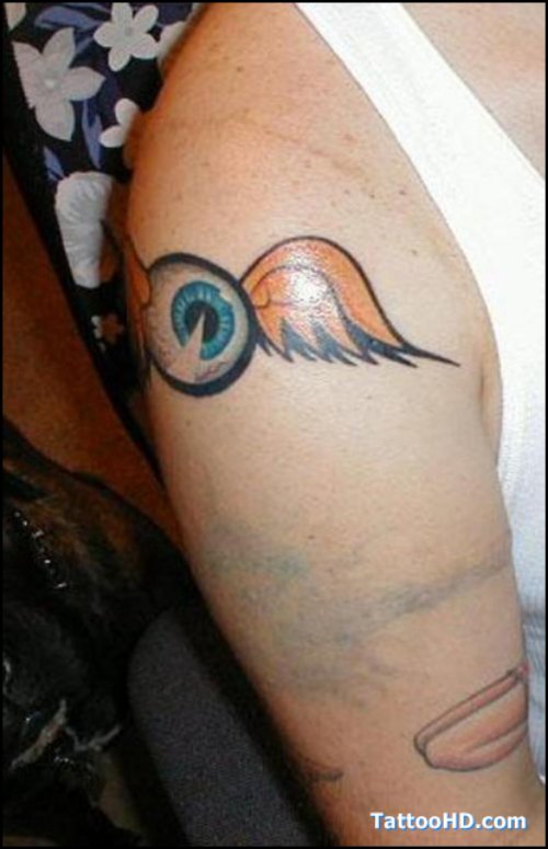 Winged Eye Tattoo On Right Shoulder