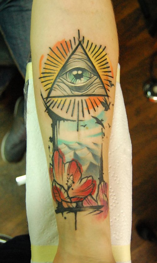 Colored Ink Eye Of Sea Tattoo On Arm