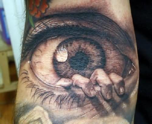 Big eye And Hand Tattoo