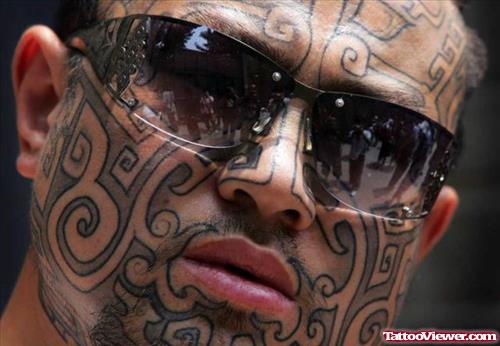 Horrible Tribal Face Tattoo