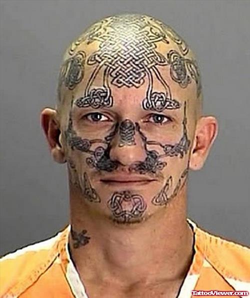 Grey Ink Celtic Face Tattoo